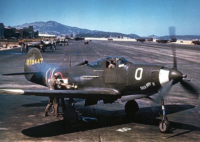 Two mechanics crank the handle of a USAAF Bell P-39Q-1-BE Airacobra, at Hamilton Army Airfield, California (USA), in July of 1943. The aircraft "Saga Boy II" (serial no. 42-19447) belonged to Lt.Col. Edwin S. Chickering,