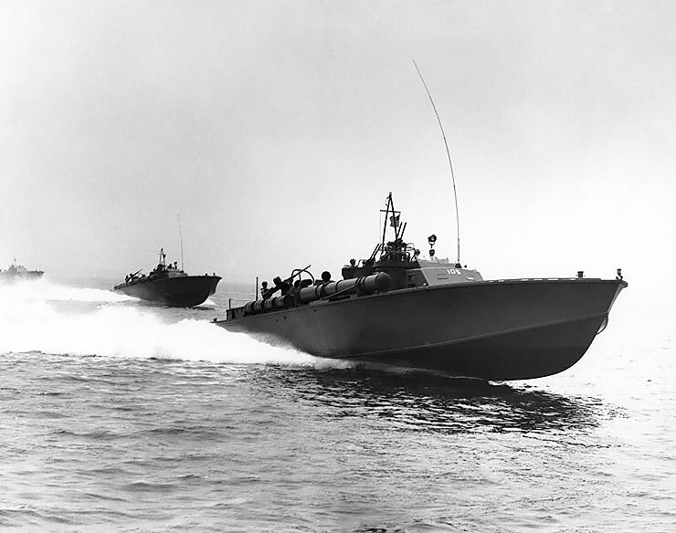 USS PT-105 running at high speed, during exercises off the U.S. East Coast with other units of Motor Torpedo Boat Squadron Five, 12 July 1942