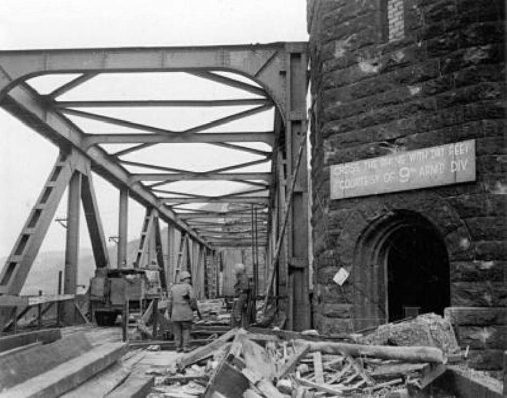 CROSS THE RHINE WITH DRY FEET COURTESY OF 9TH ARM'D DIV-LUDENDORFF BRIDGE POSTED SIGN