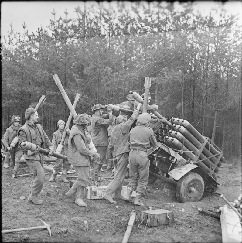 British troops loading rocket projectiles in preparation for the offensive in the Reichswald, Germany.