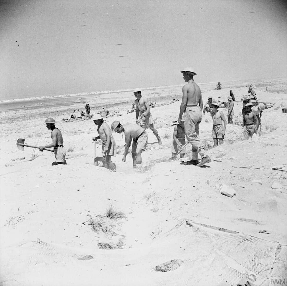 IWM caption : El Alamein 1942: British troops dig in at El Alamein during the first battle.