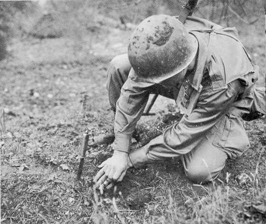 Members of 504th Parachute Infantry Regiment practising their mine-detecting skills.