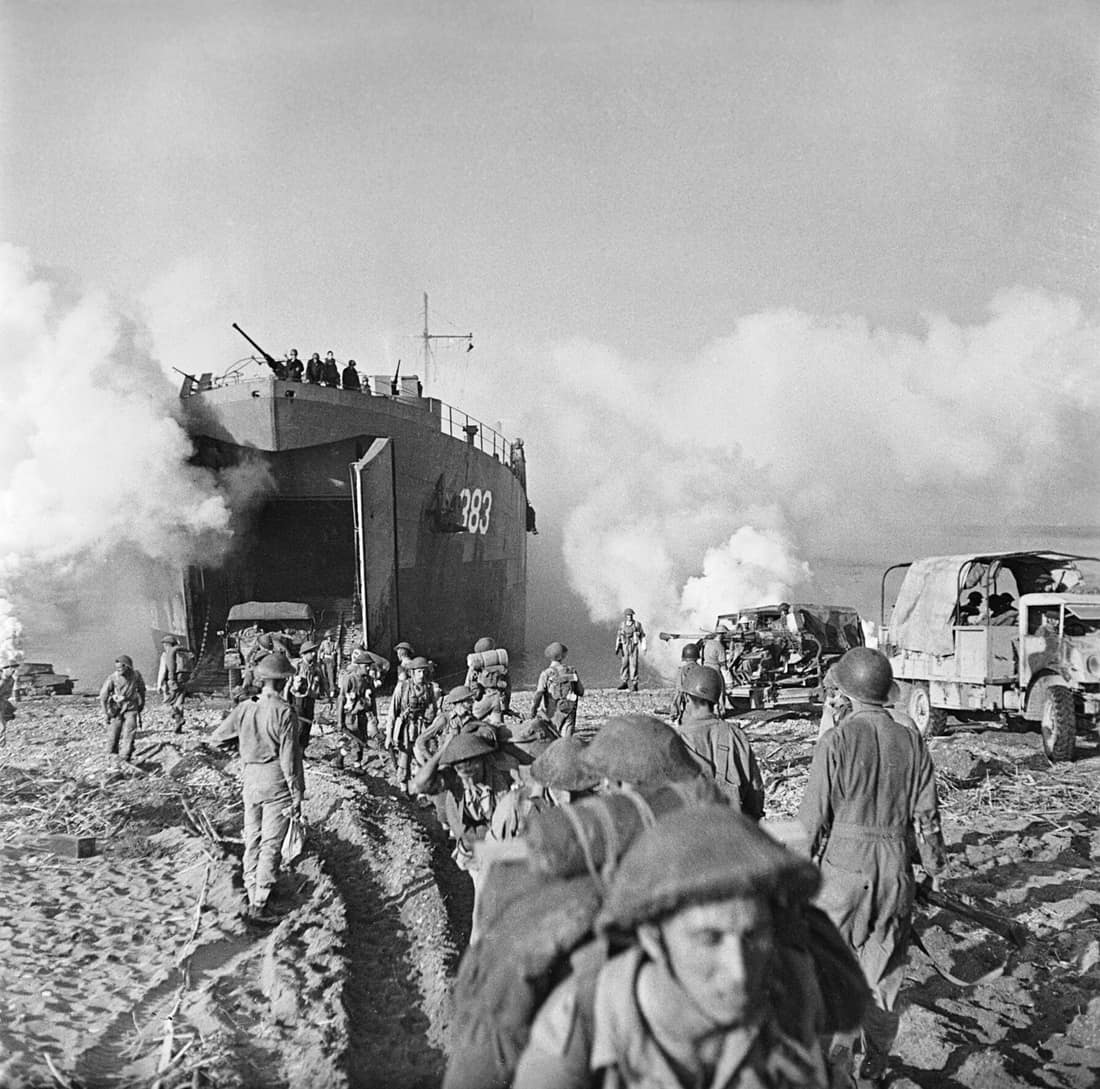Salerno, 9 September 1943 (Operation Avalanche): British troops and vehicles from 128 Brigade, 46th Division are unloaded from LST 383 onto the beaches.