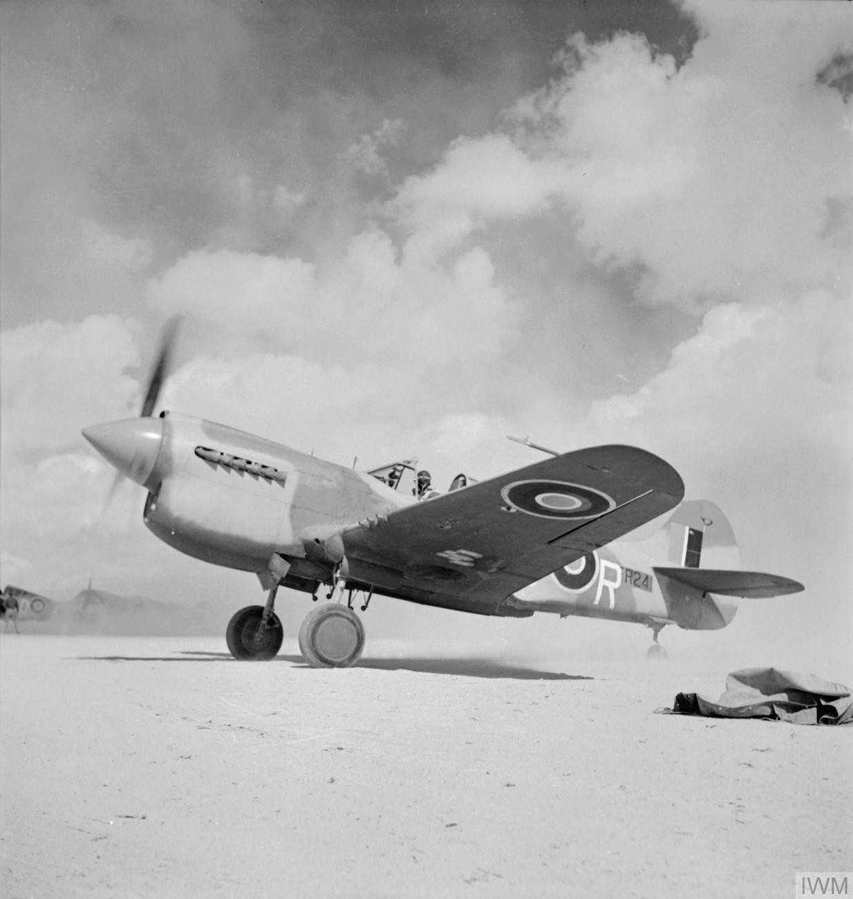 IWM caption : Kittyhawk Mark III, FR241 LD-R, of No. 250 Squadron RAF, taxying at LG 91, Egypt, during Operation LIGHTFOOT, the first phase of the Alamein offensive. FR241 is an early short-tail Mark III with a dorsa