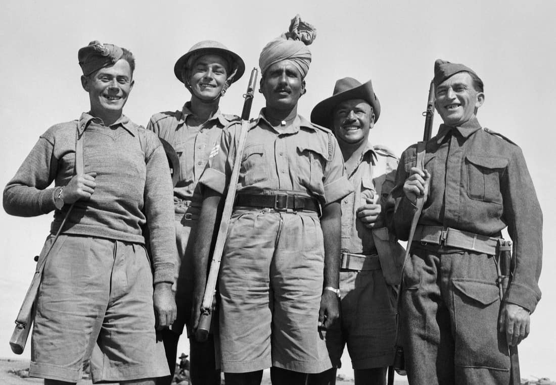 Soldiers from each of five different allied armies fighting together against the Germans and Italians in Tobruk, Libya. From the left they are Polish, British, Indian, Australian and Czech.