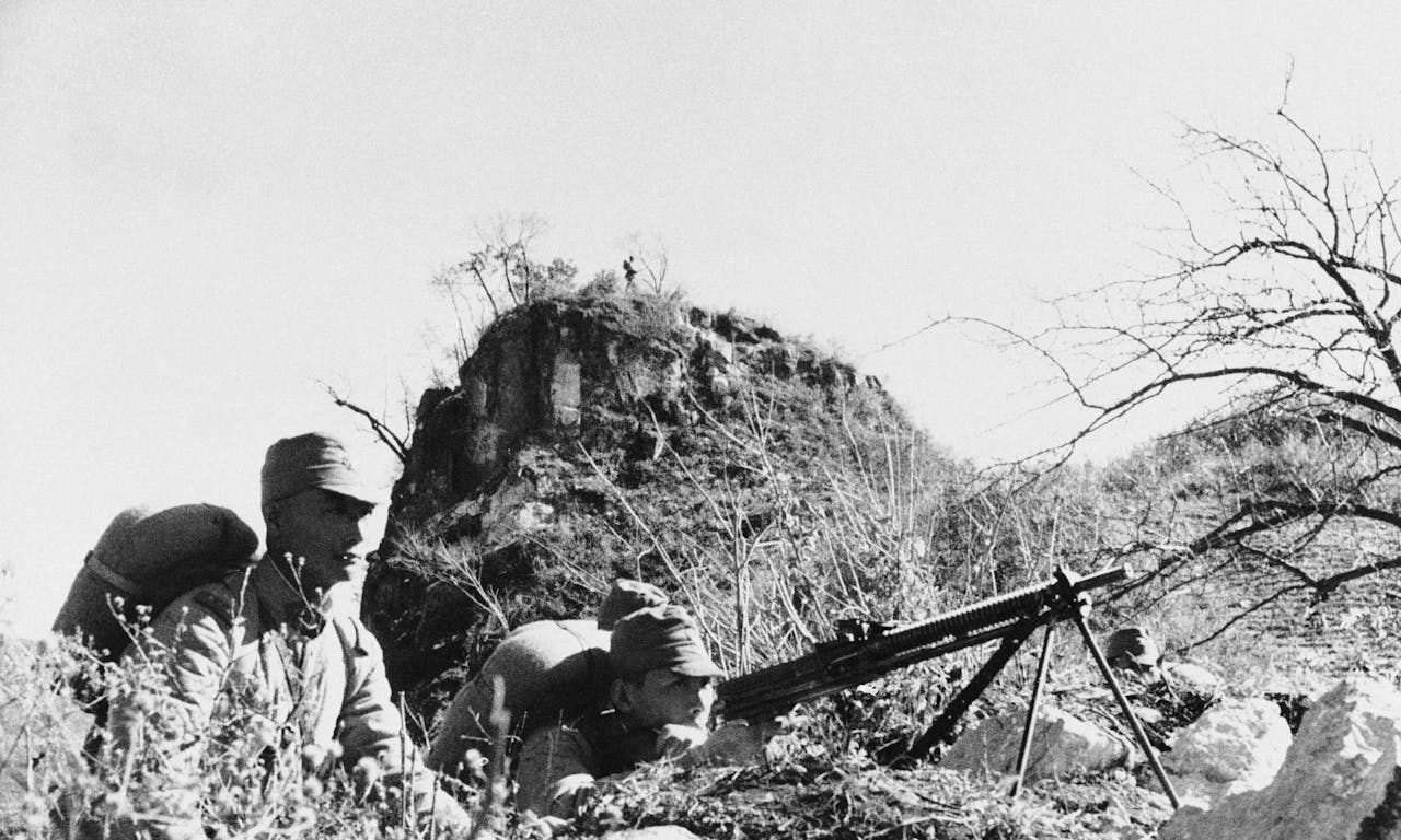 Japanese soldiers man a machine gun post along the banks of the Heilongjiang River (Amur River) in Manchuria on August 8, 1945.