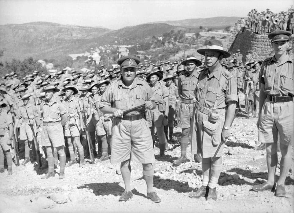 Hammana, Lebanon. September 2, 1941. Major General A. S. "Tubby" Allen (centre), commander of the Australian 7th Division, with Lt Colonel Murray Moten (centre right), commander of the 2/27th Infantry Battalion and his m