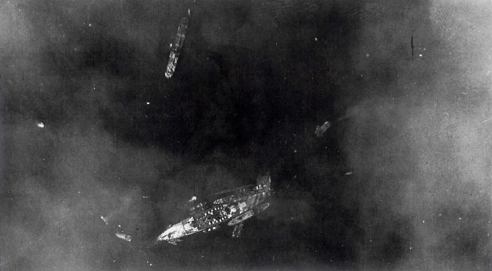 AWM: TARANTO, ITALY, 1940-11. AERIAL VIEW SHOWING AFTERMATH OF ACTION AGAINST THE ITALIAN FLEET IN TARANTO HARBOUR. NHHC: Italian BB LITTORIO of Littorio Class (1937-1948). Ship later renamed ITALIA. Photo 1940. November