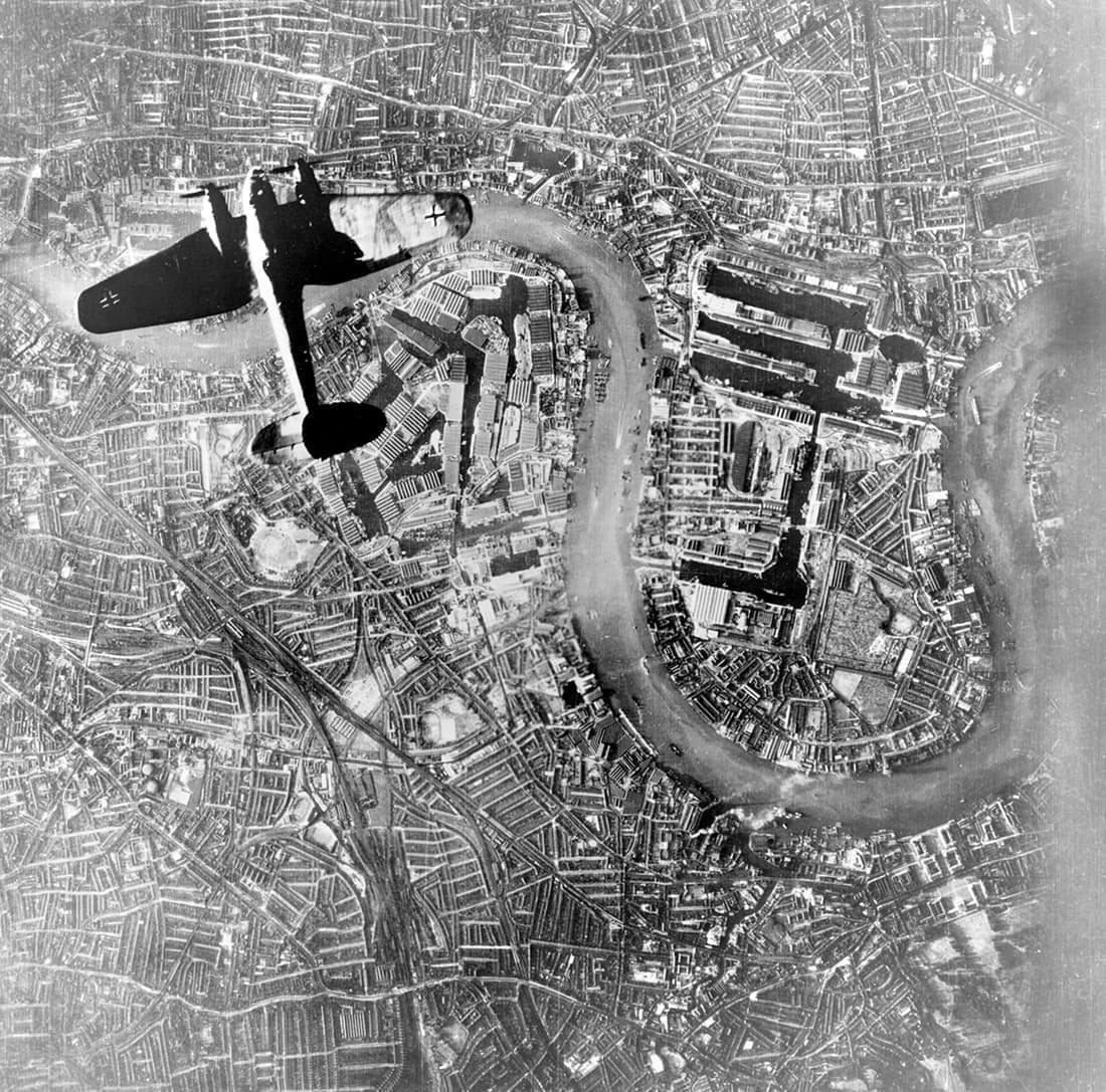Operations: A German Luftwaffe Heinkel He 111 bomber flying over Wapping, London at the start of the Luftwaffe's evening raids of 7 September 1940. Copy negative of part of an aerial photograph taken from a German aircra