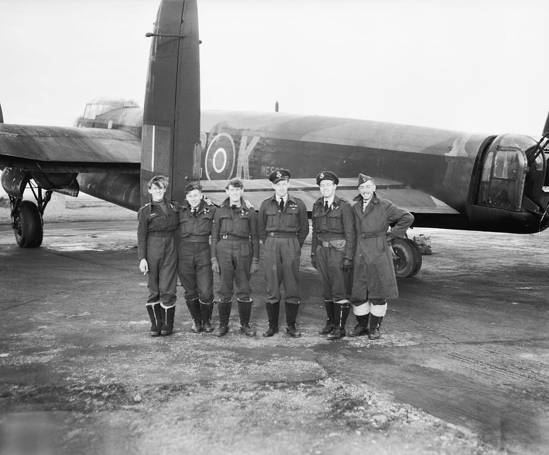 Royal Air Force 1939-1945- Bomber Command Flying Officer J Sanders DFC (third from right), and his cheerful crew of No 617 Squadron with their Lancaster, ME562/KC-K, following the successful daylight operation against th