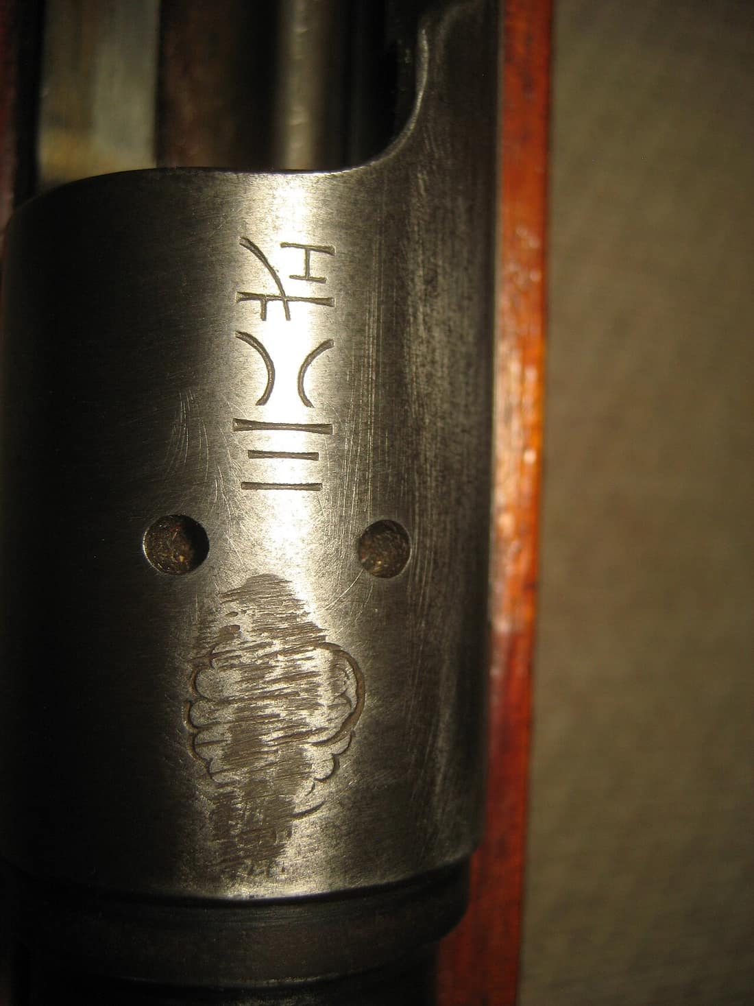 Inscriptions found on top part of receiver of a Japanese Arisaka Type 38 rifle