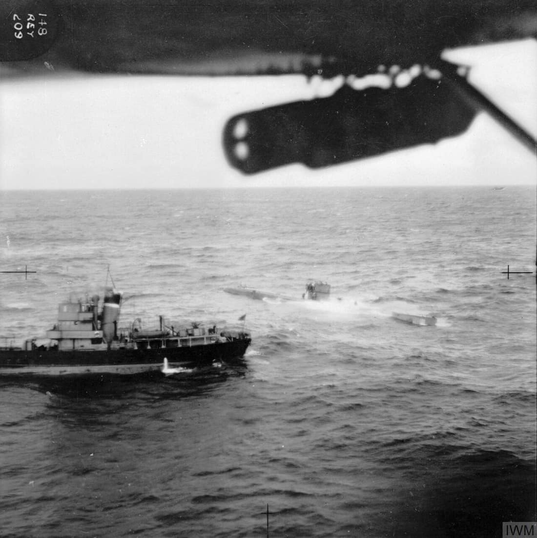 Capture of the German submarine U570. The surfaced submarine is alongside a Royal Navy ship. Taken from RAF Catalina aircraft of 209 Squadron.