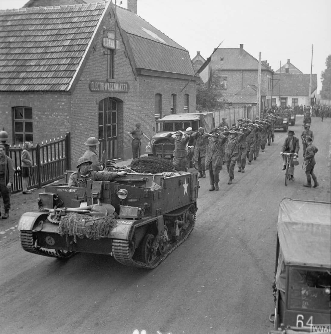 A Bren Gun Carrier (Universal/Windsor) brings in a batch of German prisoners during 158 Brigade's attack. 158 Brigade (53 Division) was tasked to cross the Escaut Canal near Lommel in order to continue the advance into H