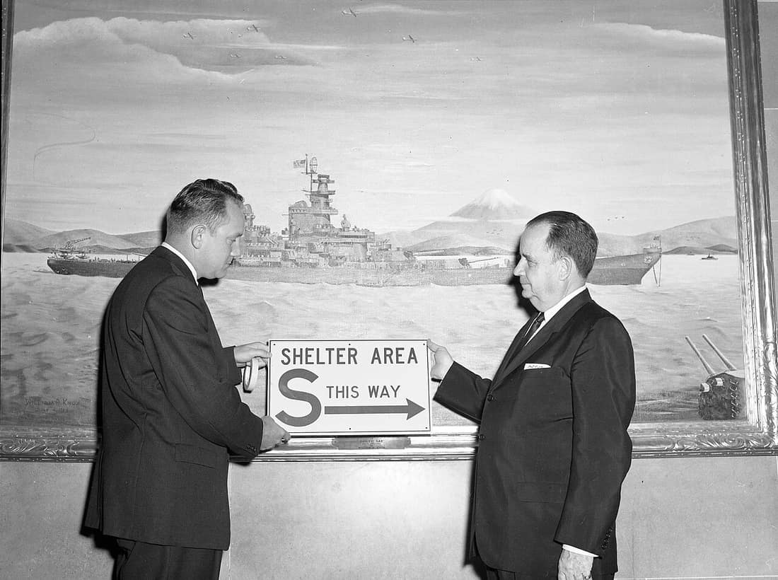 Collection Name: Commerce and Industrial Development Photograph Collection Photographer/Studio: Massie, Gerald R. Description: Civil Defense Director Dean Lupkey and Governor John Dalton hold up "Shelter Area" sign in fr