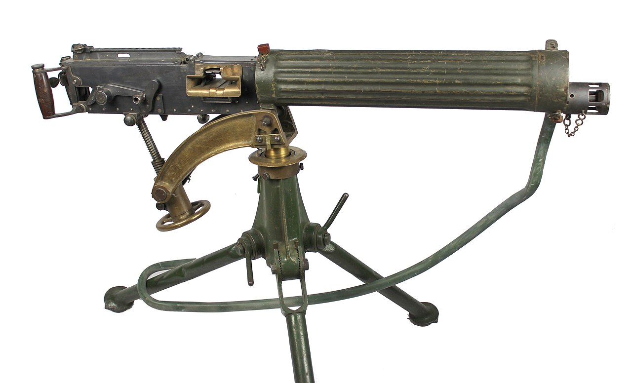 Standard Vickers machine gun with tripod mount and associated ammunition belt, ammunition box plus petrol can (as a condenser can) with hose. The Vickers Gun was the standard British machine gun from 1912. It was heavy a