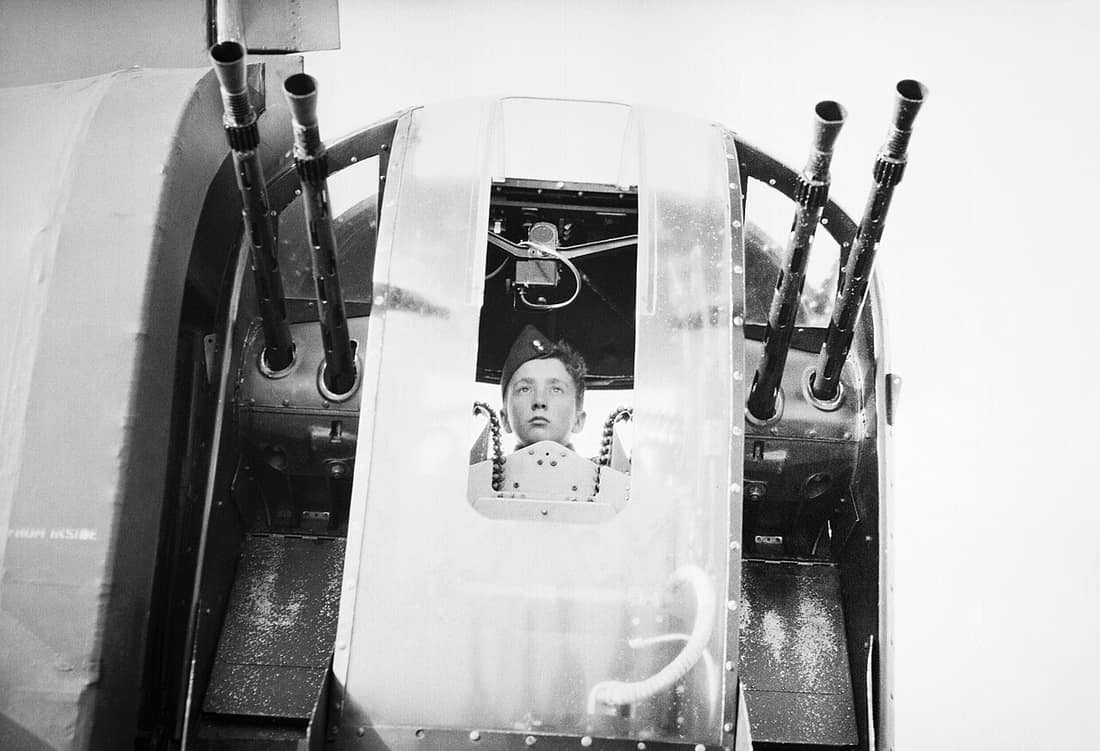 15-year-old cadet Tommy McMordie from Luton Air Training Corps (ATC) in a Wellington bomber's rear turret at No 12 Operational Training Unit (OTU) at Chipping Warden, Northamptonshire, 17 September 1944. Boys from the Lu