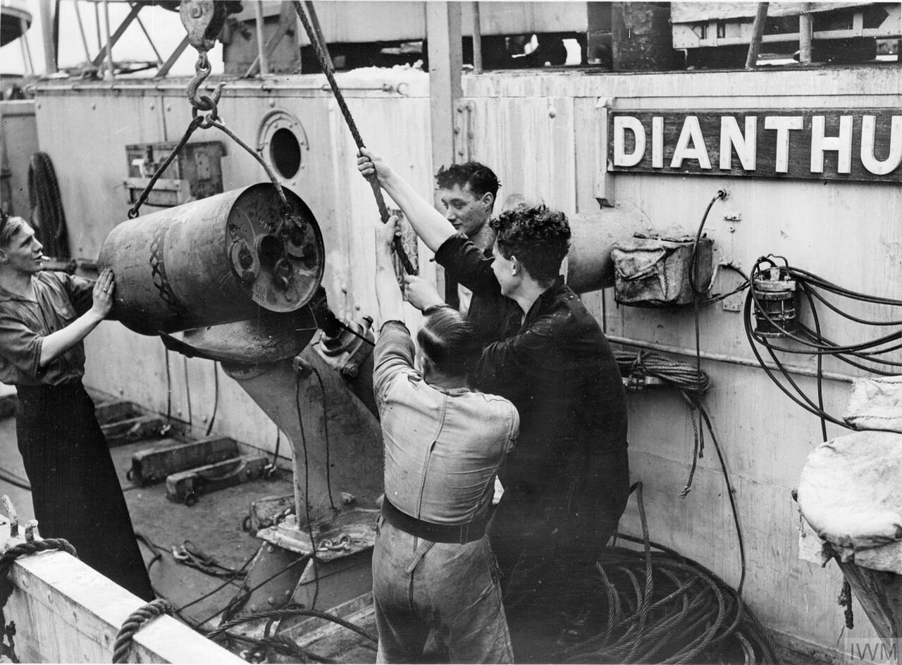 Anti-Submarine Weapons: A Mk VII depth charge being loaded onto a Mk IV depth charge thrower on board Flower class corvette HMS Dianthus.