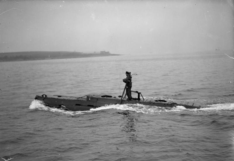 The Royal Navy during the Second World Wat X-Craft 25 underway in Loch Striven, near Rothesay with Lieut J E Smart, RNVR, the Commanding Officer on deck by the conning tower.